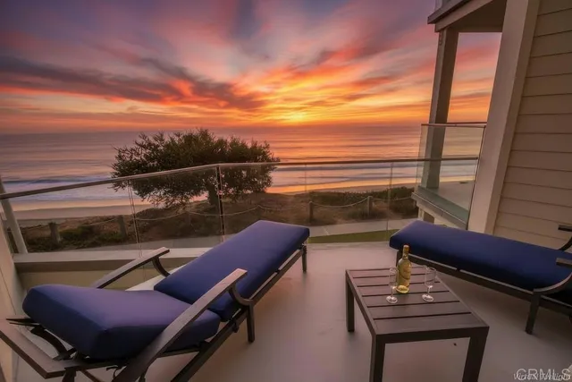 a view of a balcony with chairs
