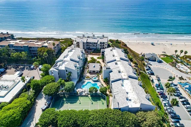 an aerial view of residential houses with outdoor space