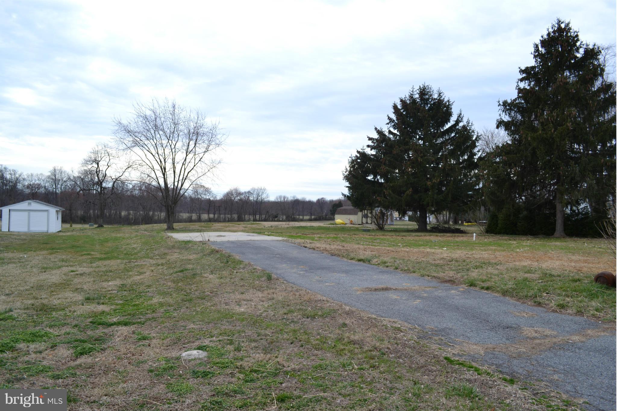 View of lot and entrance drive from street