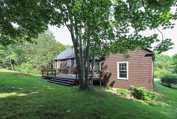 31 Decatur Street Gloucester, MA 01930 - Photo 12 of 17 a backyard of a house with wooden floor and fence