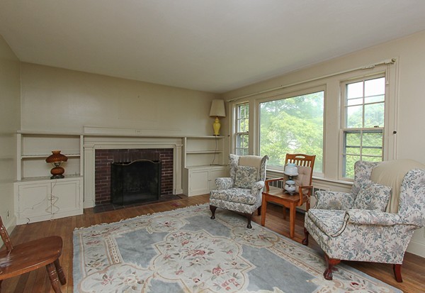 31 Decatur Street Gloucester, MA 01930 - Photo 3 of 17 a living room with furniture and a fireplace