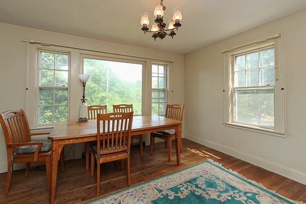 31 Decatur Street Gloucester, MA 01930 - Photo 4 of 17 a view of a dining room with furniture a chandelier and wooden floor