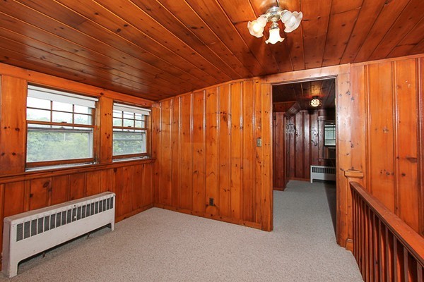 31 Decatur Street Gloucester, MA 01930 - Photo 9 of 17 wooden floor in an empty room with a window
