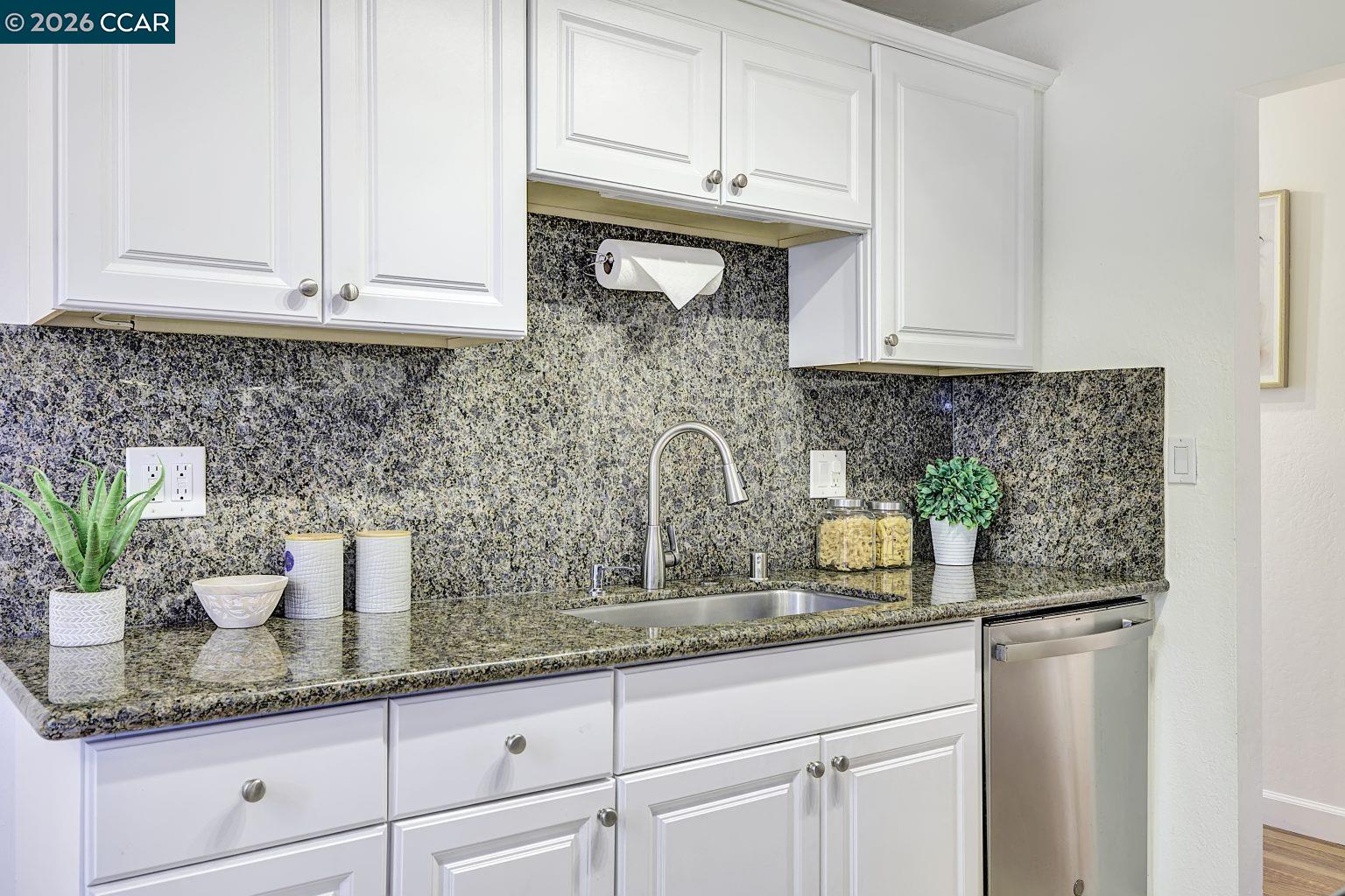 2650 Jones Road, Unit 14 Walnut Creek, CA 94597 - Photo 13 of 44 a kitchen with stainless steel appliances granite countertop a sink and cabinets