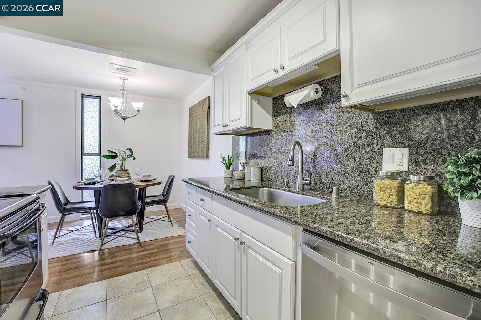 2650 Jones Road, Unit 14 Walnut Creek, CA 94597 - Photo 14 of 44 a kitchen with a sink and a stove