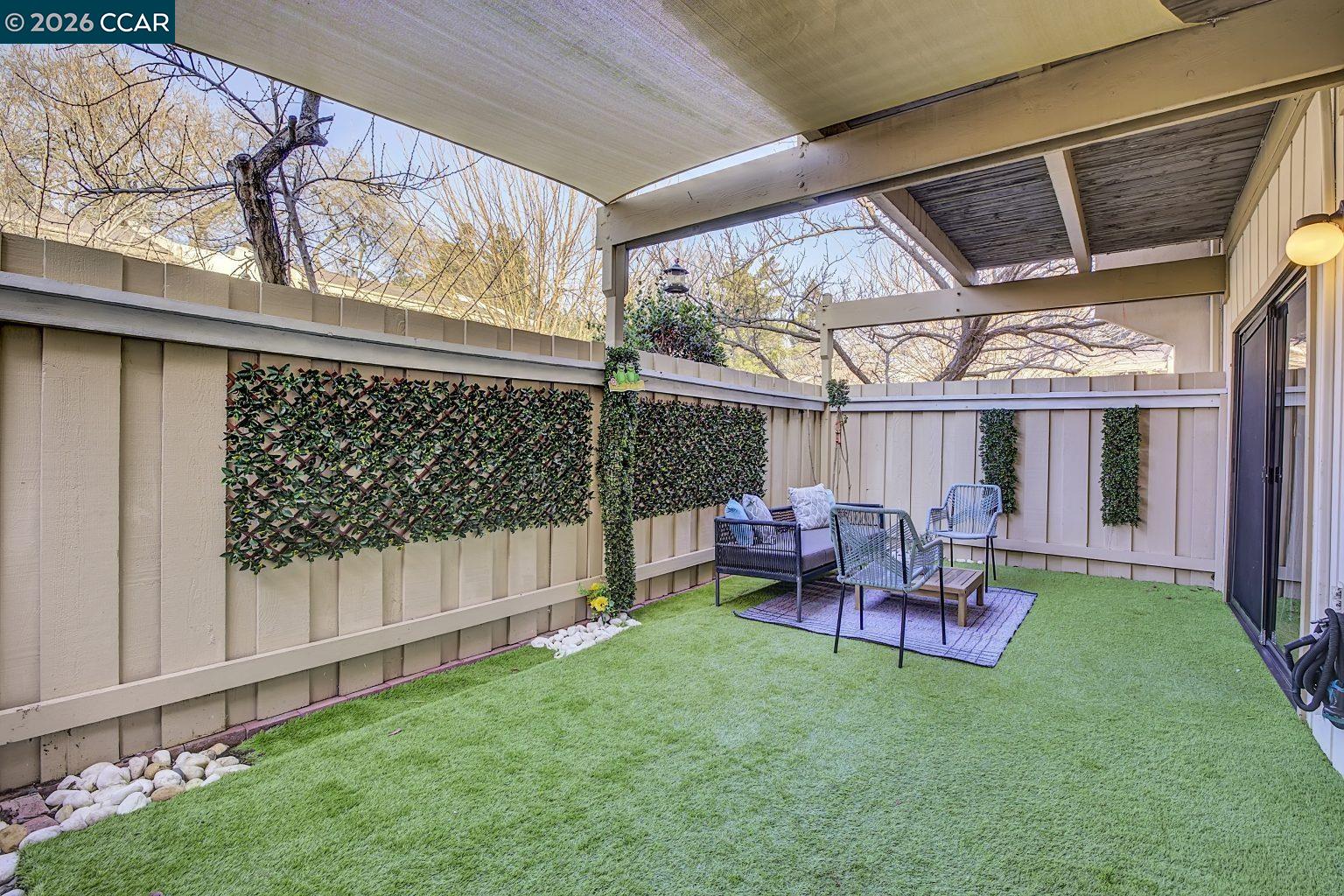 2650 Jones Road, Unit 14 Walnut Creek, CA 94597 - Photo 32 of 44 a view of a backyard with sitting area and tub