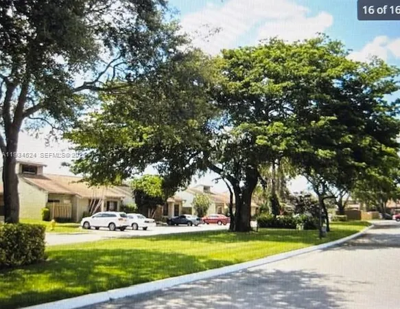 a view of a house with swimming pool and sitting area