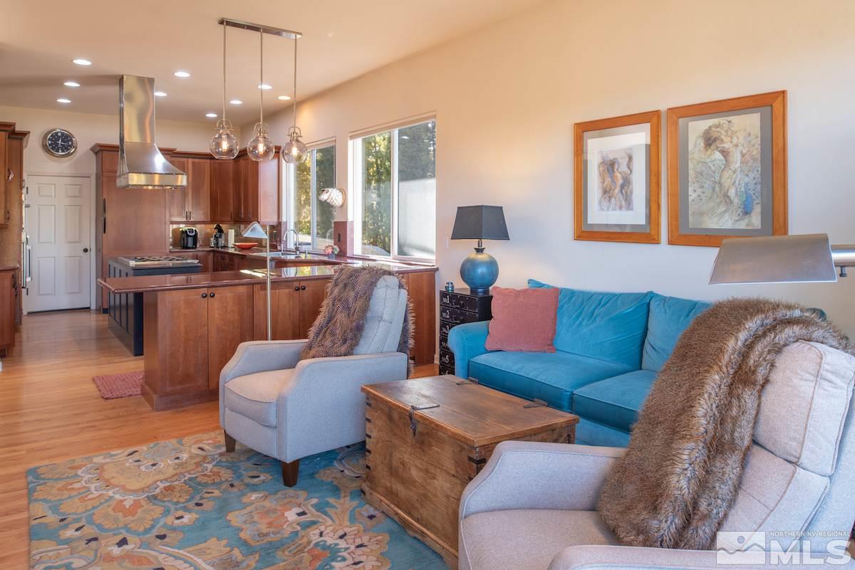 1673 Aspen Creek Road Reno, NV 89519 - Photo 11 of 40 a living room with furniture and a large mirror