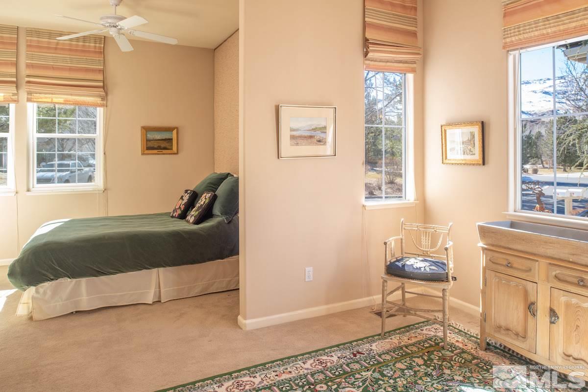 1673 Aspen Creek Road Reno, NV 89519 - Photo 18 of 40 a bedroom with a bed and wooden floor