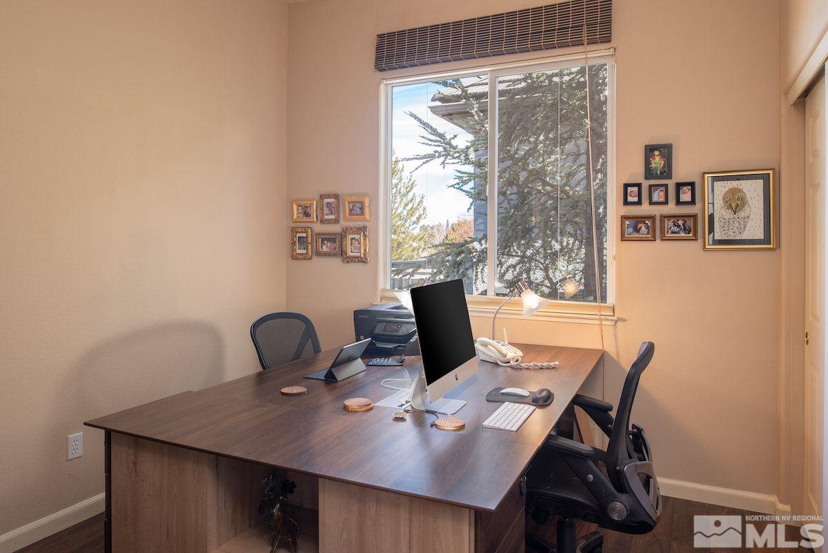 1673 Aspen Creek Road Reno, NV 89519 - Photo 20 of 40 a view of a workspace with a table and chair
