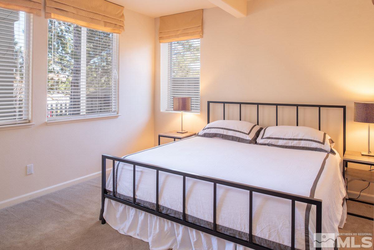 1673 Aspen Creek Road Reno, NV 89519 - Photo 24 of 40 a bed sitting in a bedroom next to a window