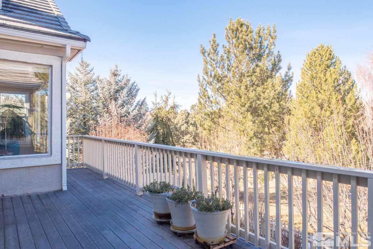 1673 Aspen Creek Road Reno, NV 89519 - Photo 28 of 40 a view of a porch with furniture and wooden floor