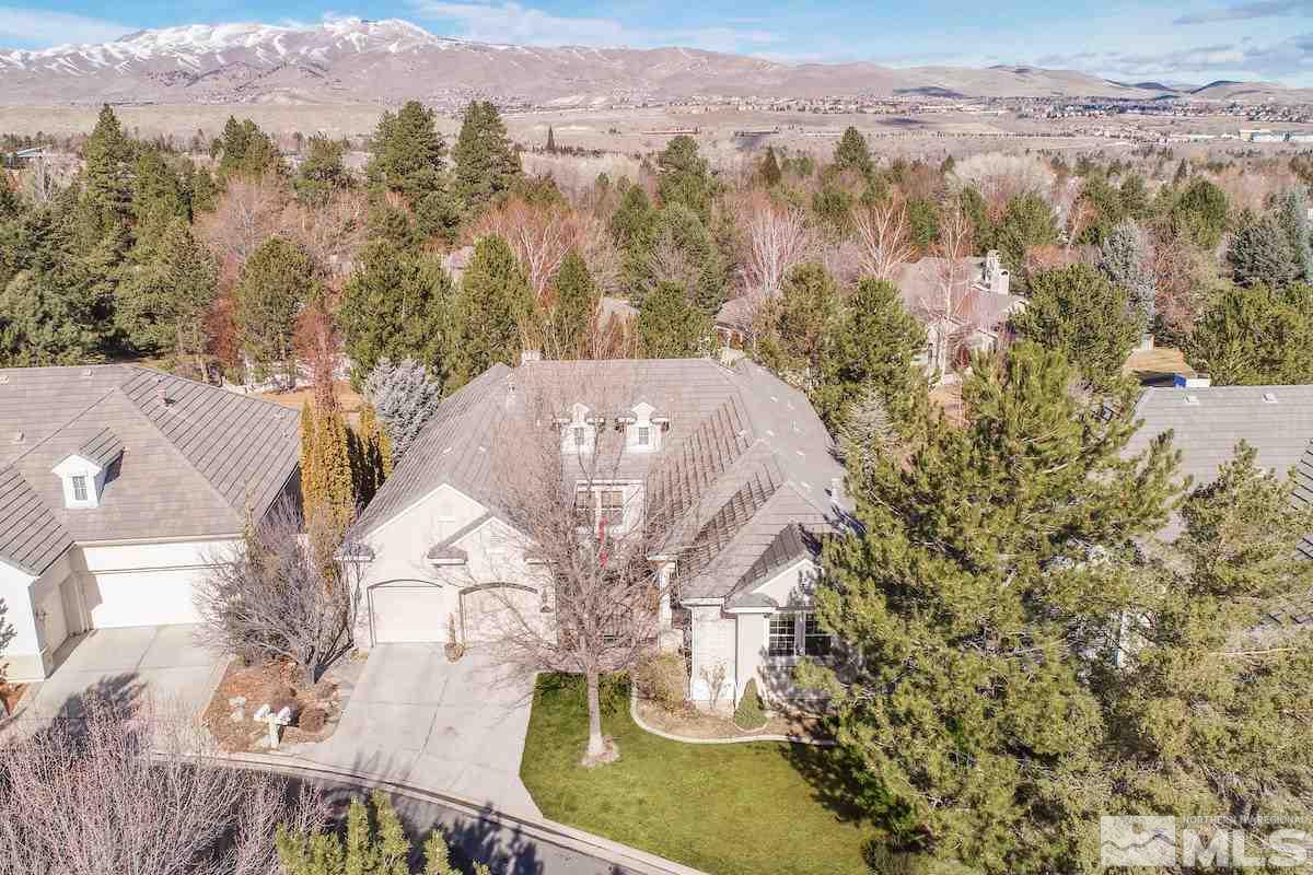 1673 Aspen Creek Road Reno, NV 89519 - Photo 3 of 40 a view of a house with a mountain in the background