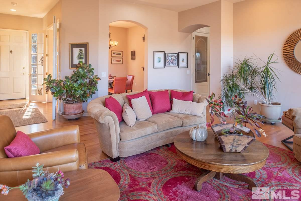 1673 Aspen Creek Road Reno, NV 89519 - Photo 5 of 40 a living room with furniture and a potted plant