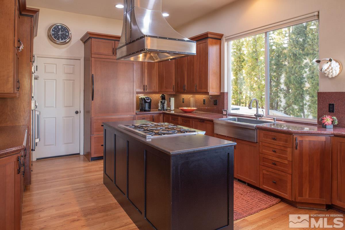 1673 Aspen Creek Road Reno, NV 89519 - Photo 9 of 40 a kitchen with a stove and a sink