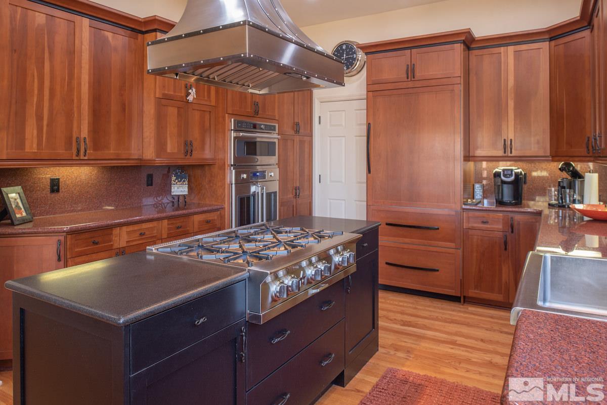 1673 Aspen Creek Road Reno, NV 89519 - Photo 10 of 40 a kitchen with a stove and a refrigerator