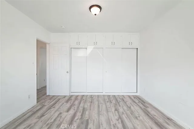 a view of patio with a table and chairs and potted plants