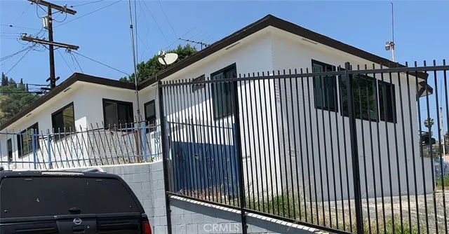 a bathroom with a sink mirror toilet and
