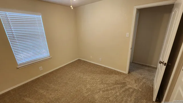 a view of a hallway with staircase