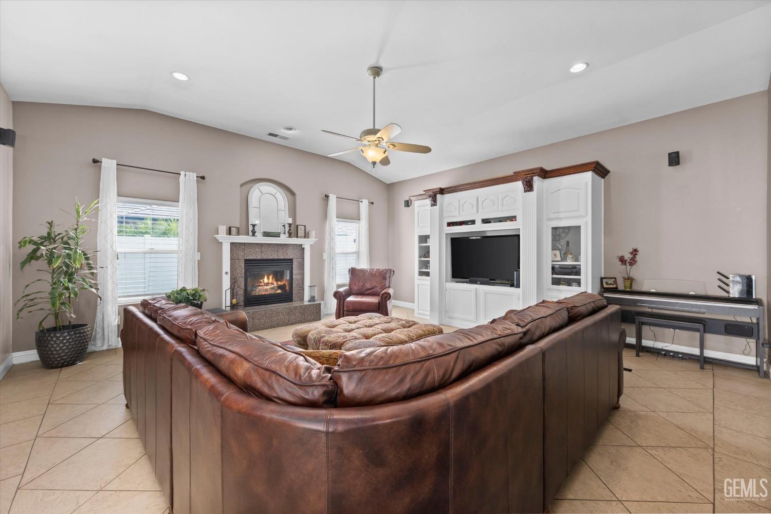 Undisclosed Address Bakersfield, CA 93314 - Photo 12 of 34 a living room with furniture and a fireplace