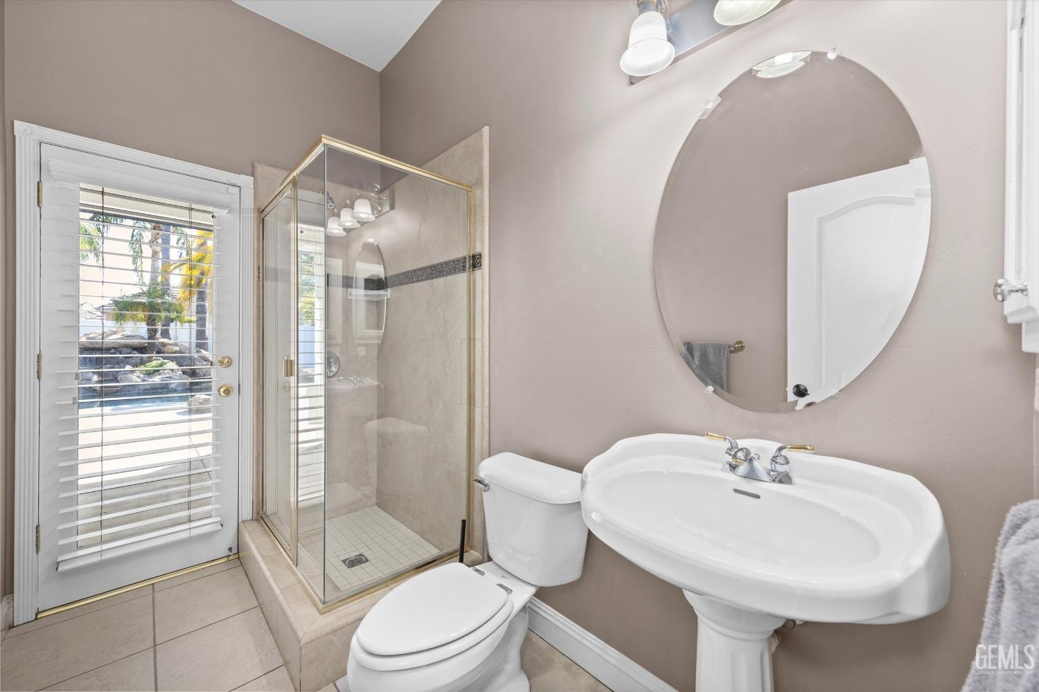 Undisclosed Address Bakersfield, CA 93314 - Photo 13 of 34 a bathroom with a sink a toilet and shower