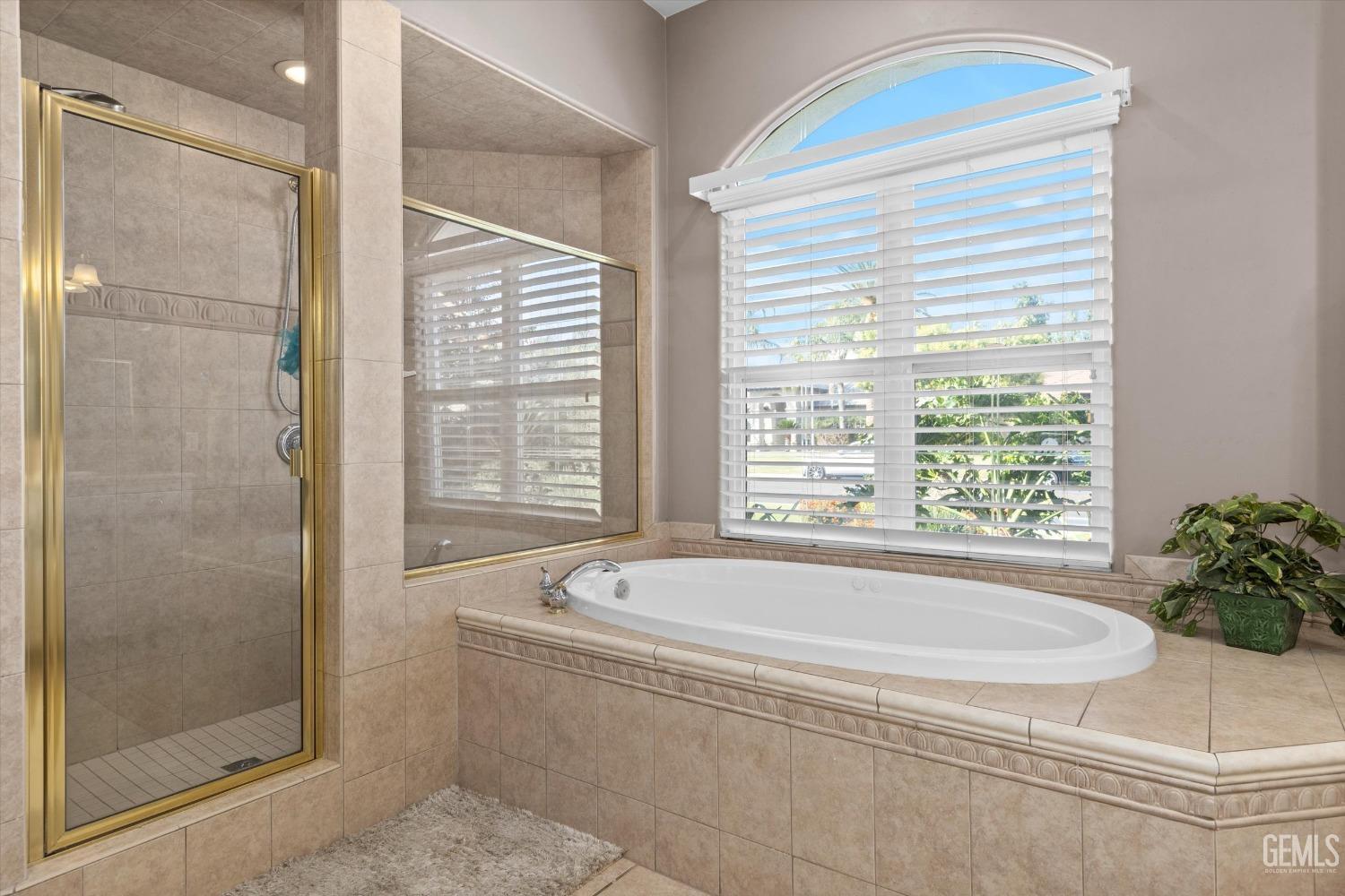 Undisclosed Address Bakersfield, CA 93314 - Photo 17 of 34 a white bath tub sitting next to a window