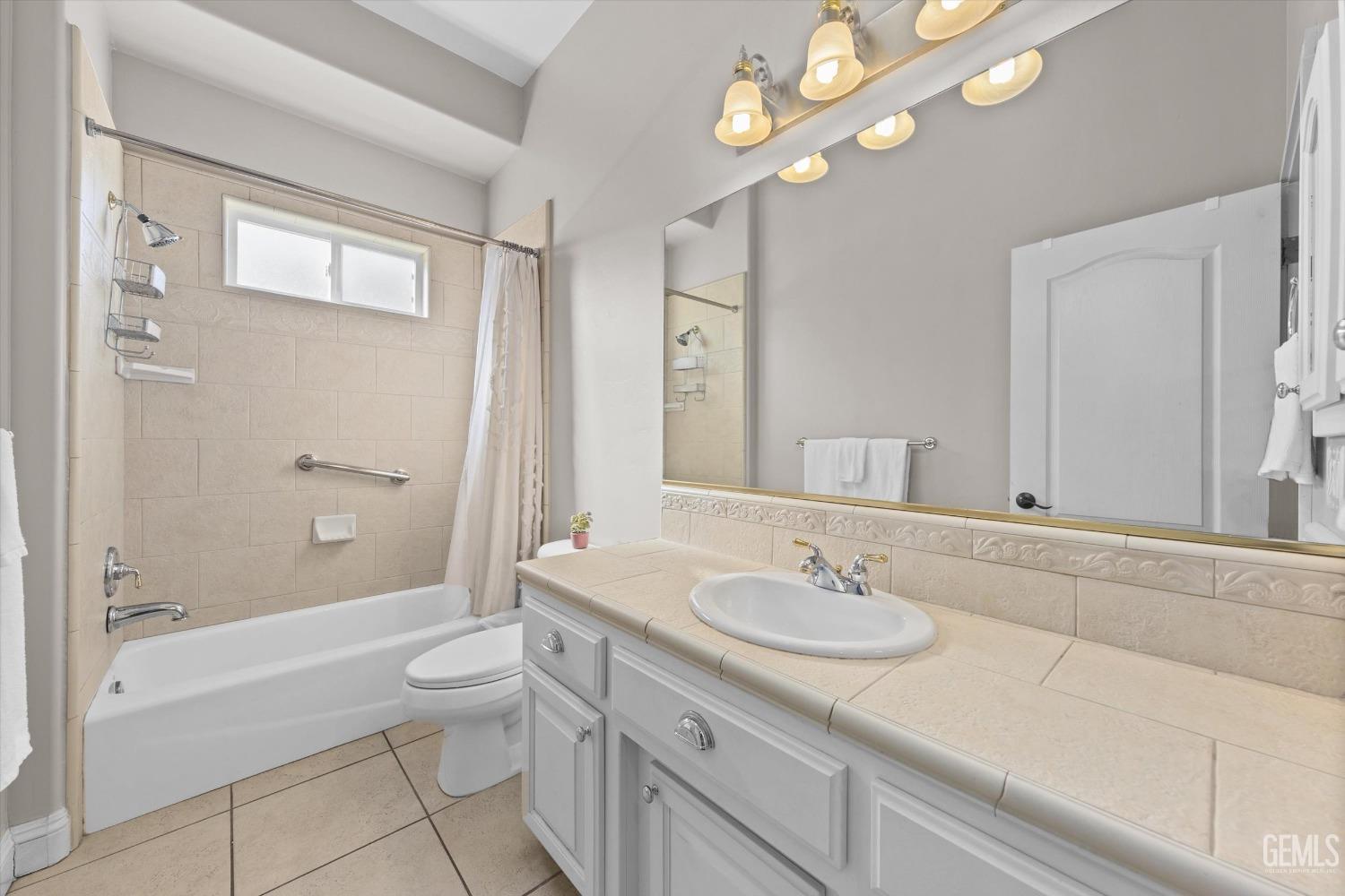 Undisclosed Address Bakersfield, CA 93314 - Photo 21 of 34 a bathroom with a sink a toilet and shower