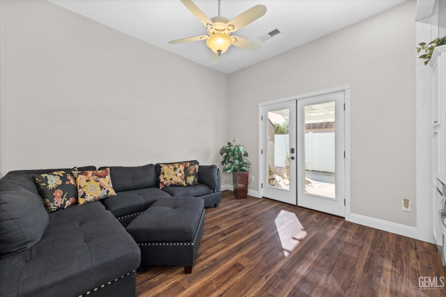 Undisclosed Address Bakersfield, CA 93314 - Photo 23 of 34 a living room with furniture and wooden floor