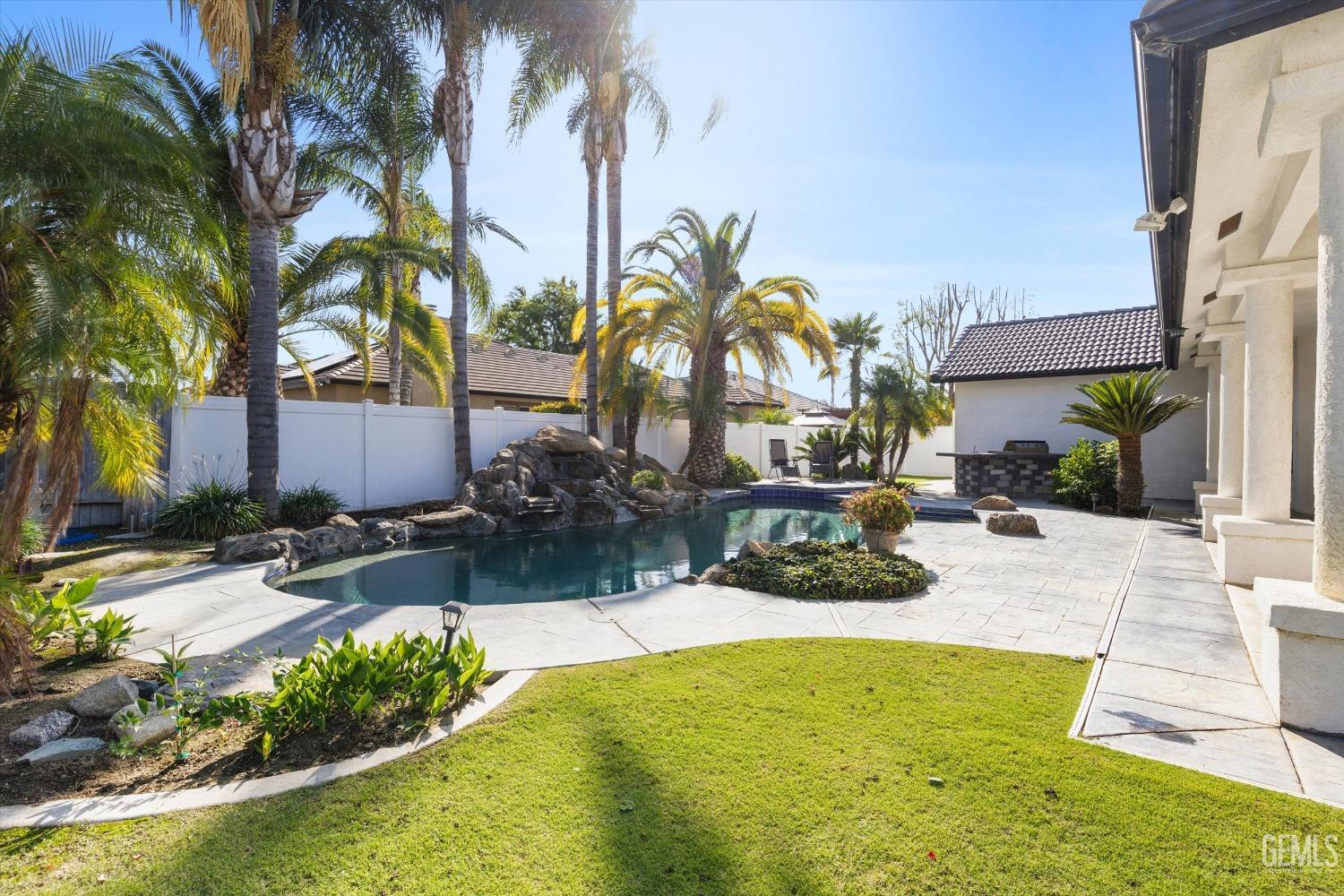 Undisclosed Address Bakersfield, CA 93314 - Photo 26 of 34 a view of swimming pool with outdoor seating and plants