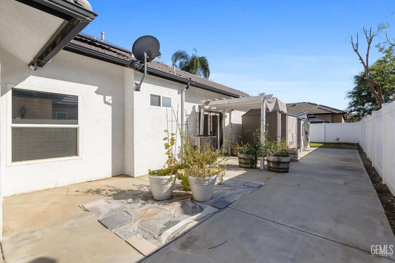 Undisclosed Address Bakersfield, CA 93314 - Photo 30 of 34 a view of a house with backyard and sitting area