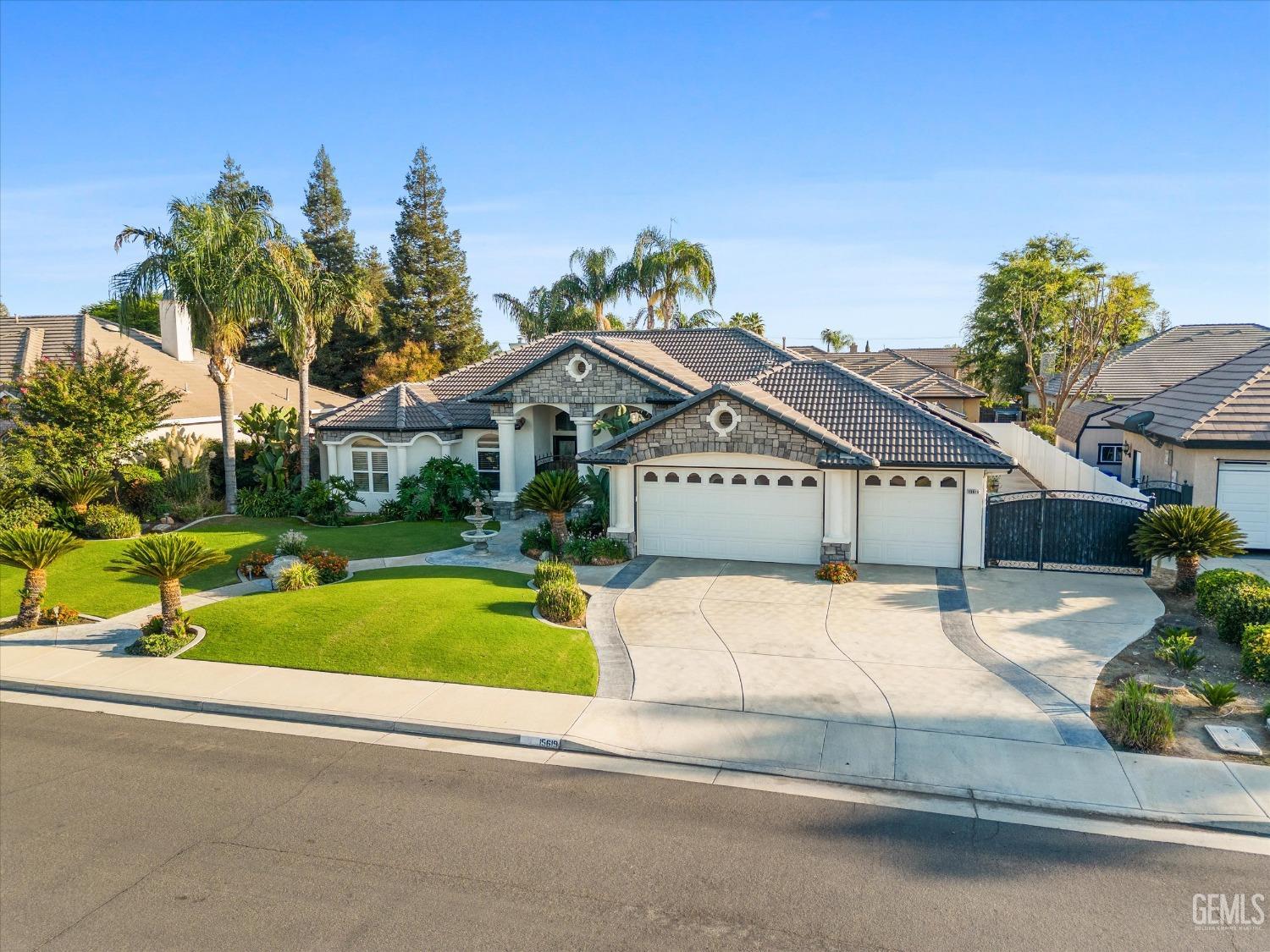 Undisclosed Address Bakersfield, CA 93314 - Photo 3 of 34 a front view of a house with a yard