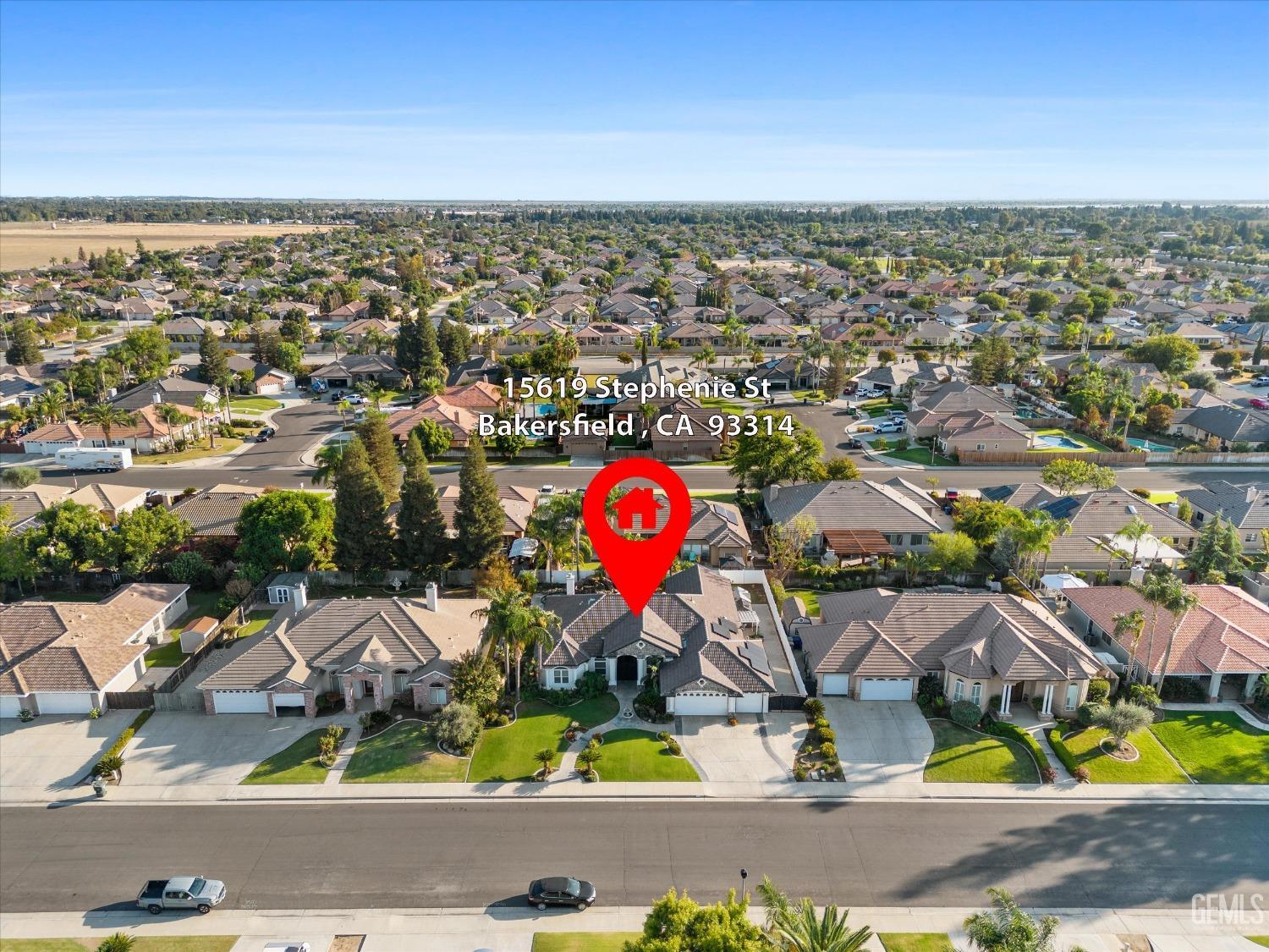 Undisclosed Address Bakersfield, CA 93314 - Photo 32 of 34 an aerial view of residential houses with swimming pool and outdoor space