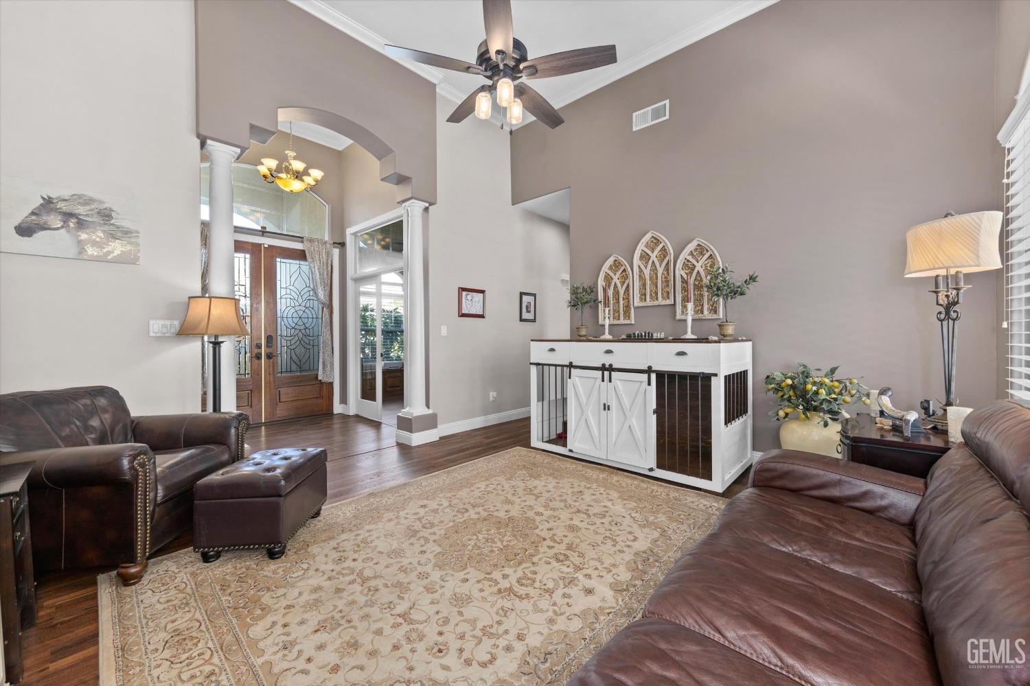Undisclosed Address Bakersfield, CA 93314 - Photo 4 of 34 a living room with furniture flowerpot and a chandelier