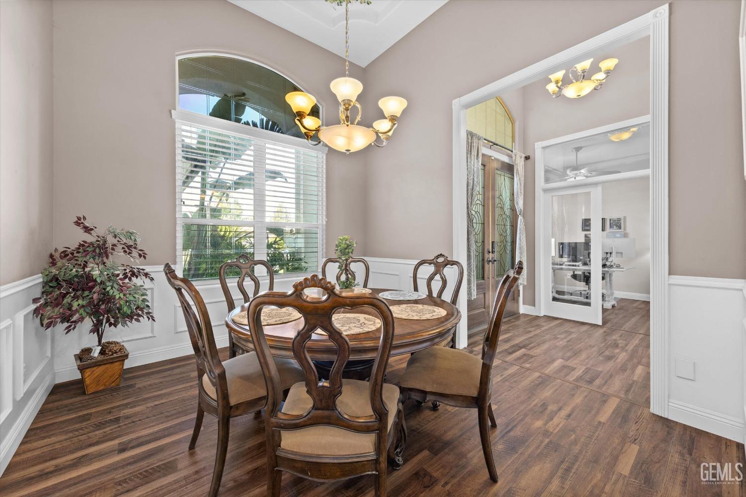 Undisclosed Address Bakersfield, CA 93314 - Photo 9 of 34 a view of a dining room with furniture and chandelier