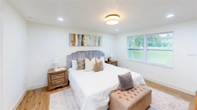 a bedroom with a bed and a couch