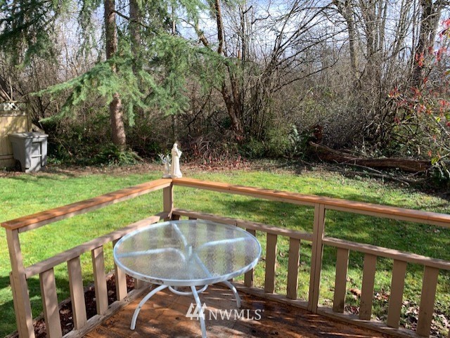 2309 Southeast 8th Drive Renton, WA 98057 - Photo 12 of 14 a backyard of a house with table and chairs