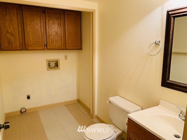 2309 Southeast 8th Drive Renton, WA 98057 - Photo 4 of 14 a bathroom with a sink toilet and vanity