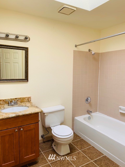 2309 Southeast 8th Drive Renton, WA 98057 - Photo 5 of 14 a bathroom with a sink a toilet and shower