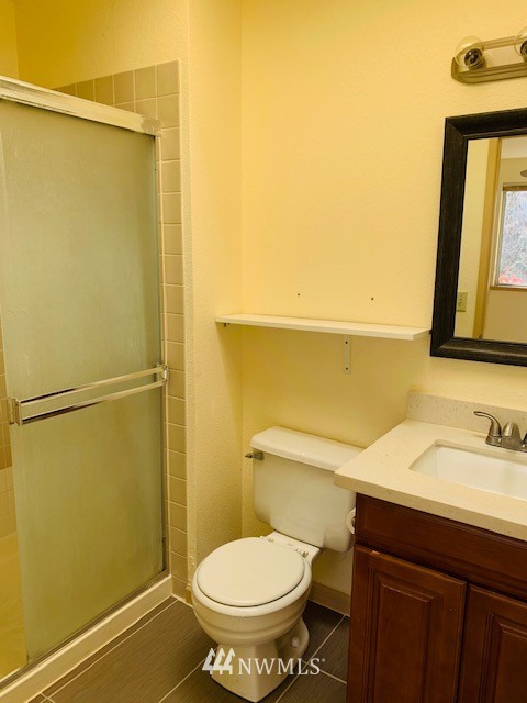 2309 Southeast 8th Drive Renton, WA 98057 - Photo 6 of 14 a bathroom with a sink and a mirror