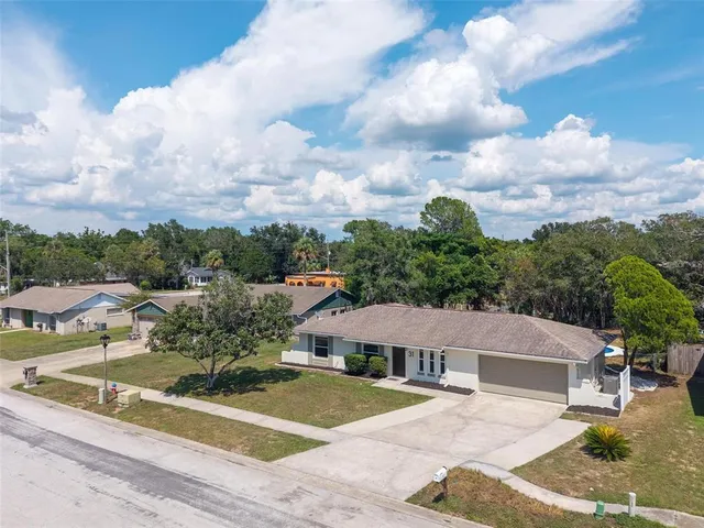 a kitchen with stainless steel appliances granite countertop a refrigerator sink and cabinets