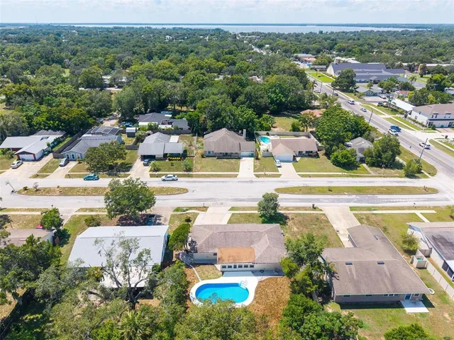 a view of a kitchen with wooden floor and a kitchen