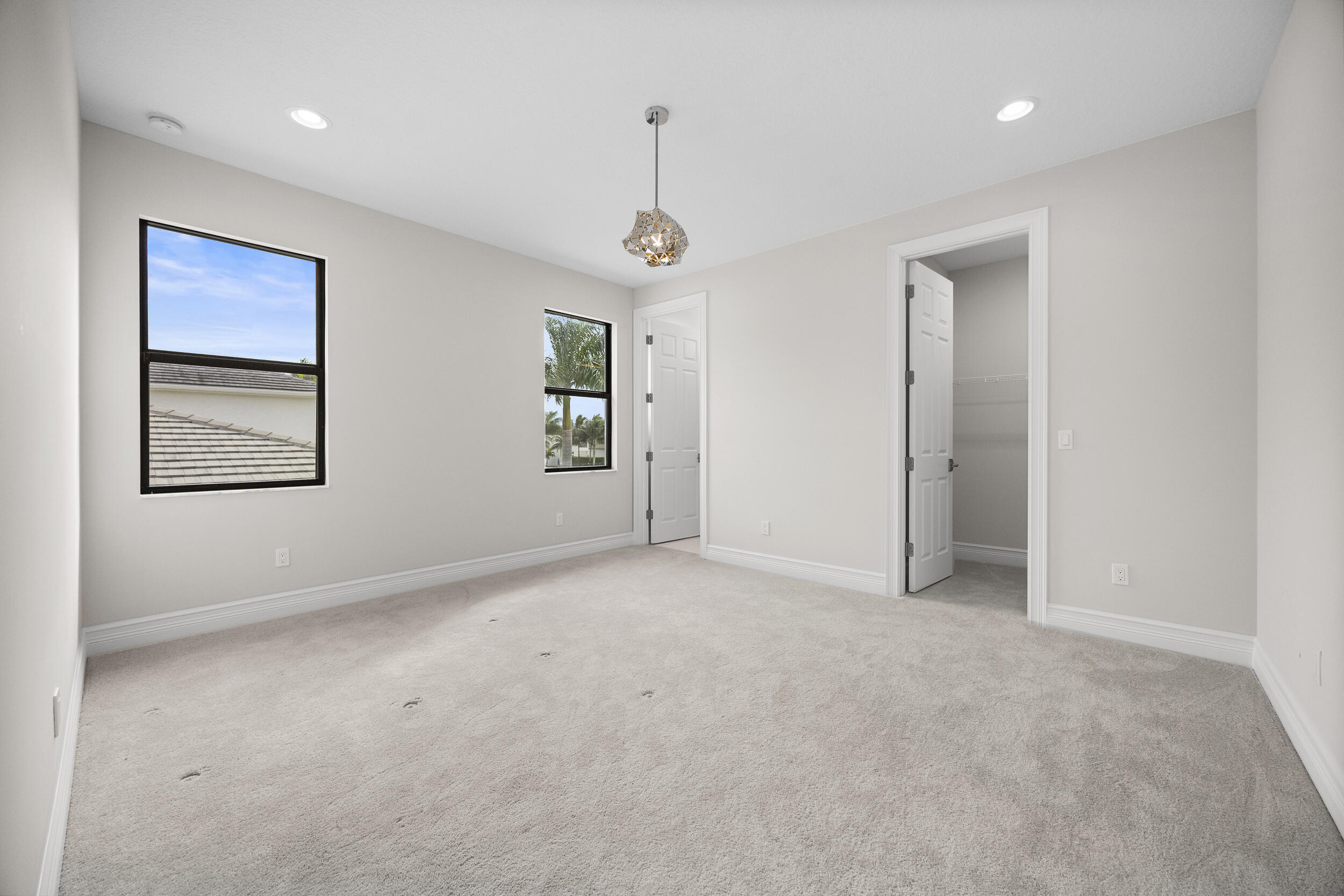 9168 Benedetta Place Boca Raton, FL 33496 - Photo 14 of 51 an empty room with windows and closet
