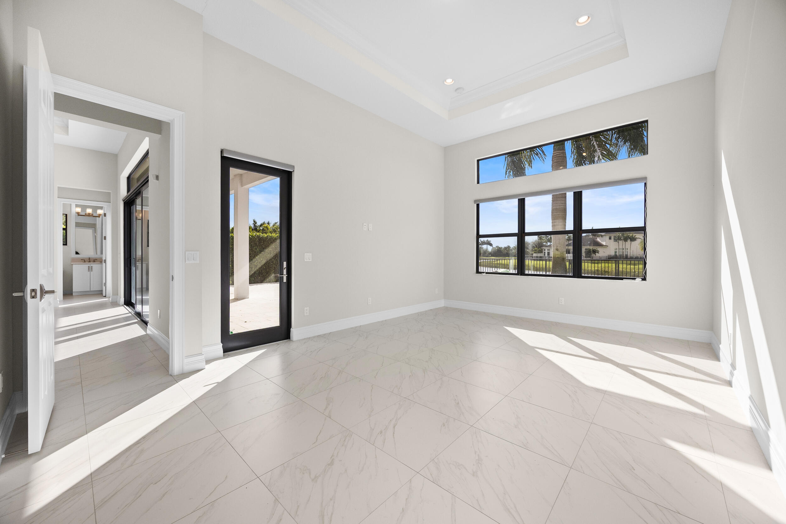 9168 Benedetta Place Boca Raton, FL 33496 - Photo 16 of 51 a view of an empty room with a window