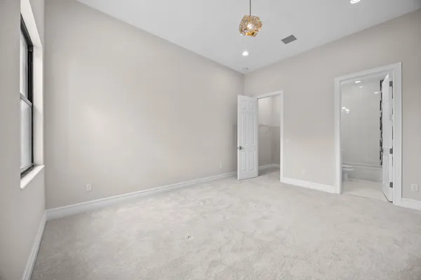 an empty room with a bathroom