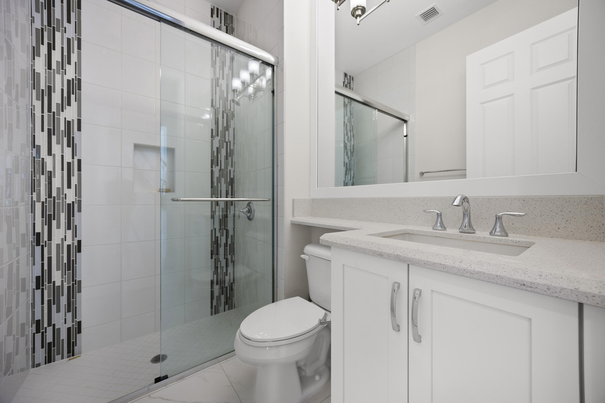 9168 Benedetta Place Boca Raton, FL 33496 - Photo 25 of 51 a bathroom with a granite countertop sink toilet and shower