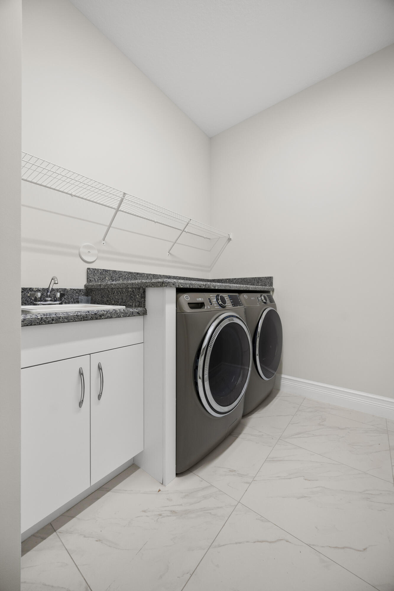 9168 Benedetta Place Boca Raton, FL 33496 - Photo 27 of 51 a utility room with sink dryer and washer