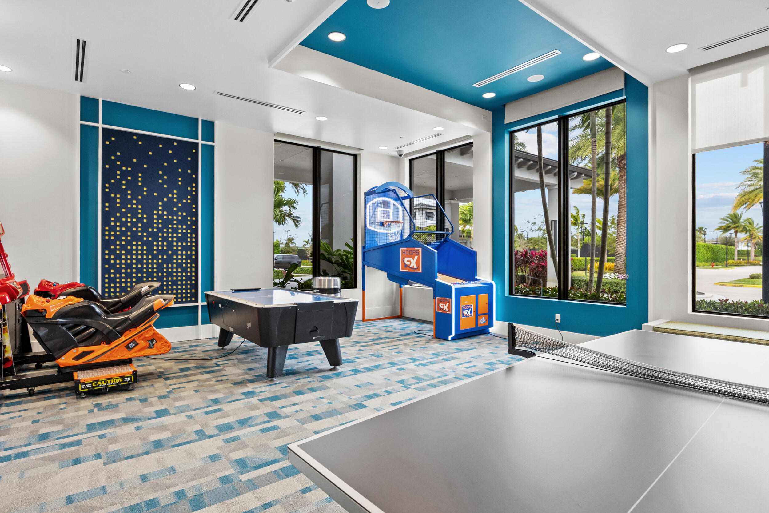 9168 Benedetta Place Boca Raton, FL 33496 - Photo 40 of 51 a living room with furniture a flat screen tv and floor to ceiling window