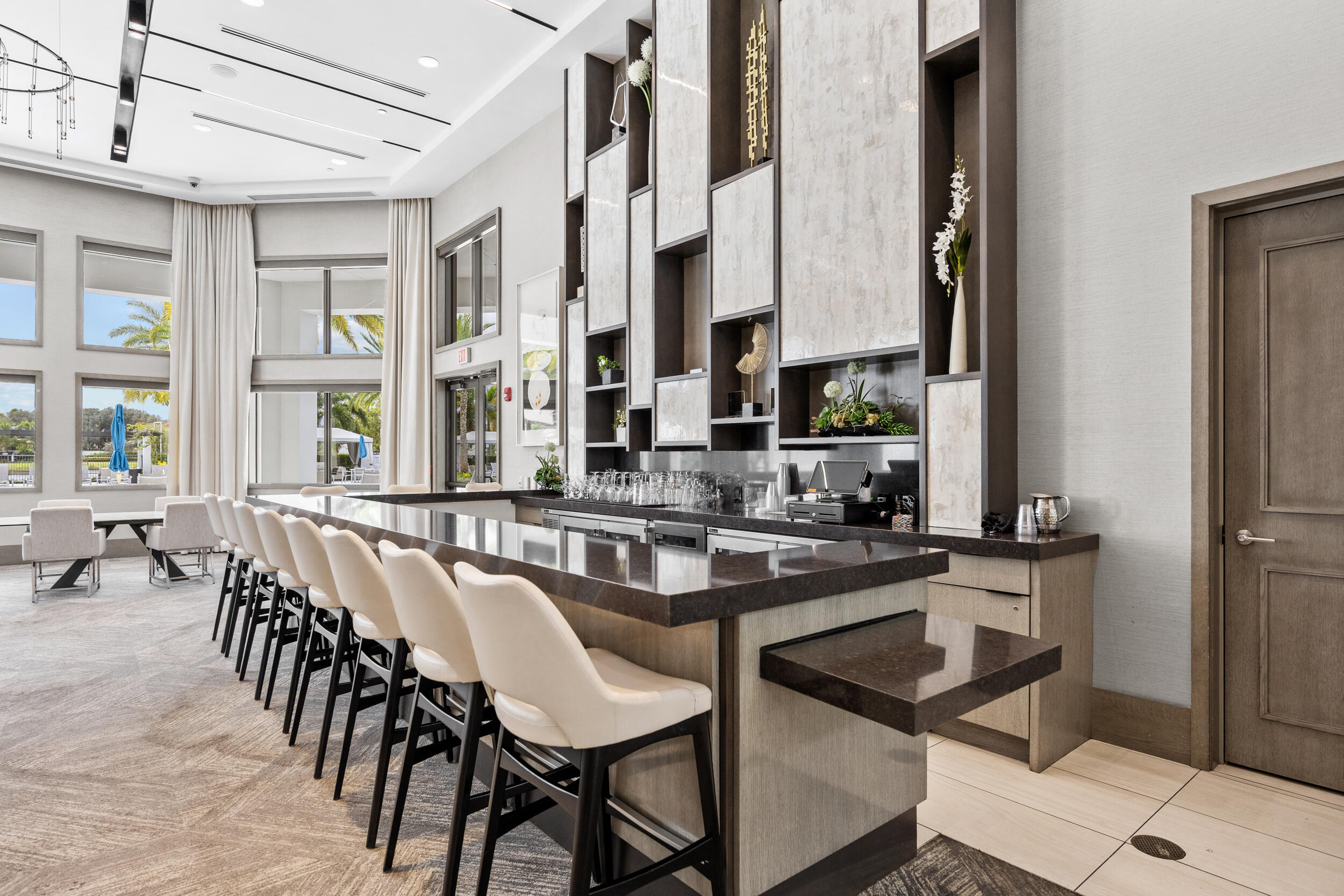 9168 Benedetta Place Boca Raton, FL 33496 - Photo 41 of 51 a dining hall with stainless steel appliances granite countertop a dining table and chairs