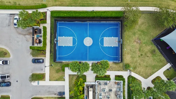 an aerial view of a house with a lake view