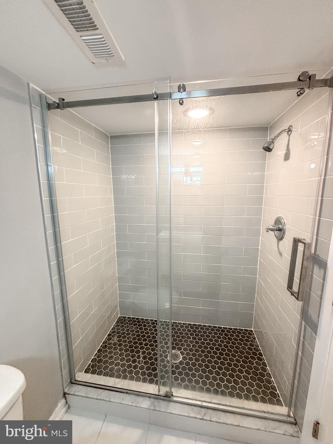 2426 Jasper Street, Unit A Philadelphia, PA 19125 - Photo 16 of 19 a bathroom with a shower